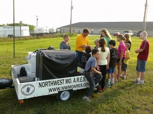 Trevor shows the group the NWMO ARES QSL card album.